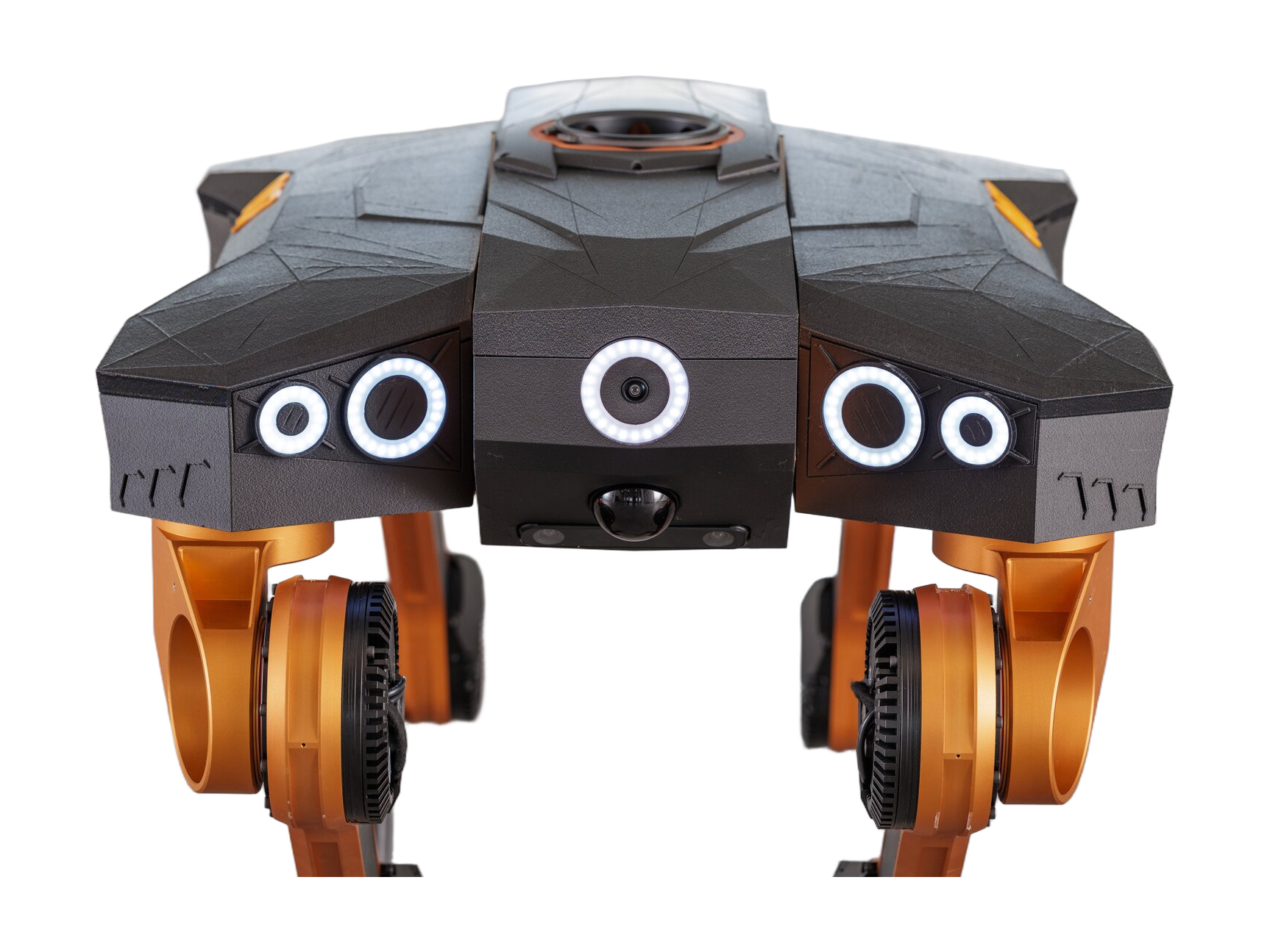All3 Mantis 2nd generation, four-legged robot with a wide, faceted black body with white light rings around the front cameras and copper-coloured hip joints, seen from the front, cropped at the thighs, manufacturer photo
